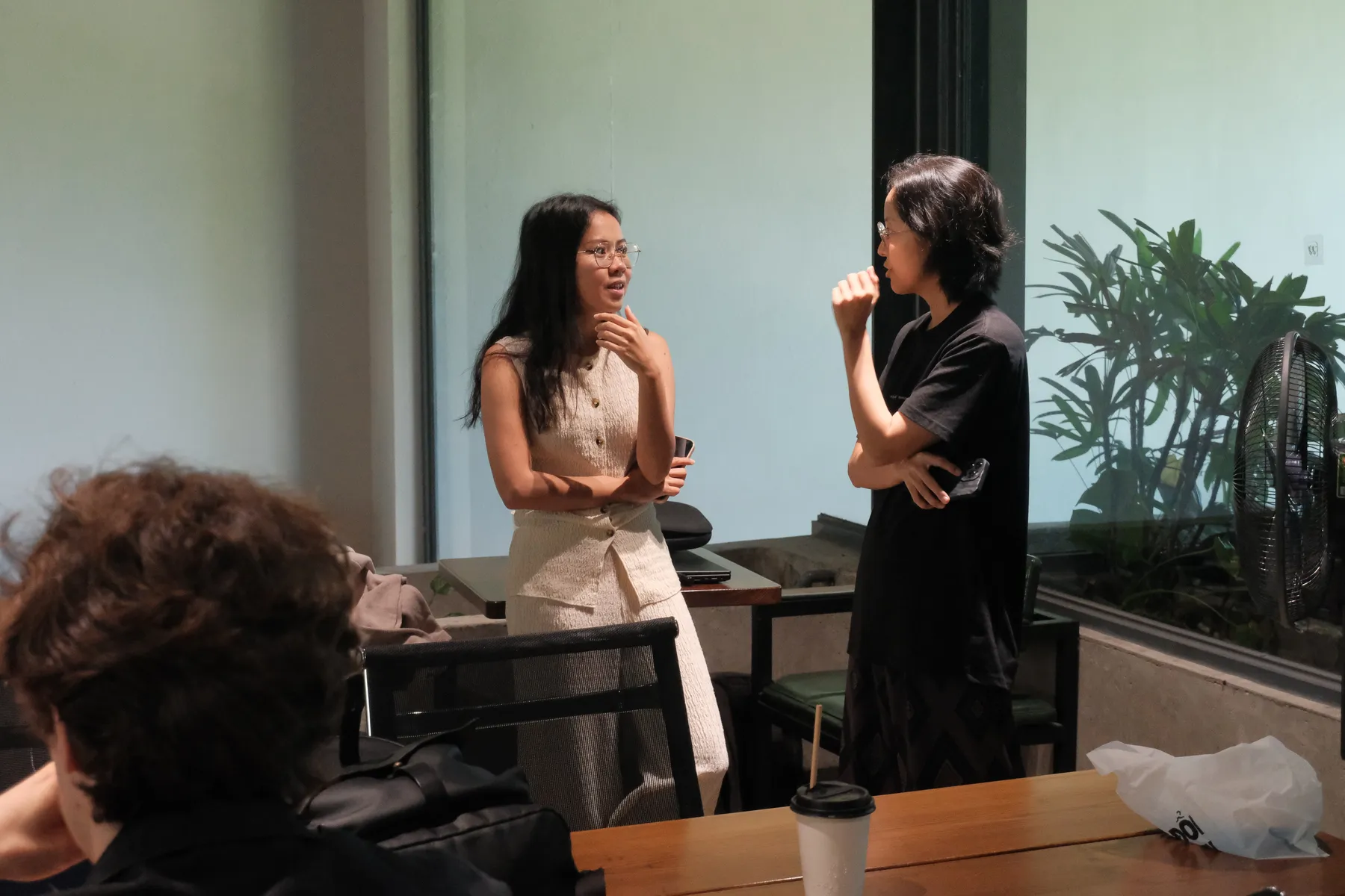 A speaker presenting to the room