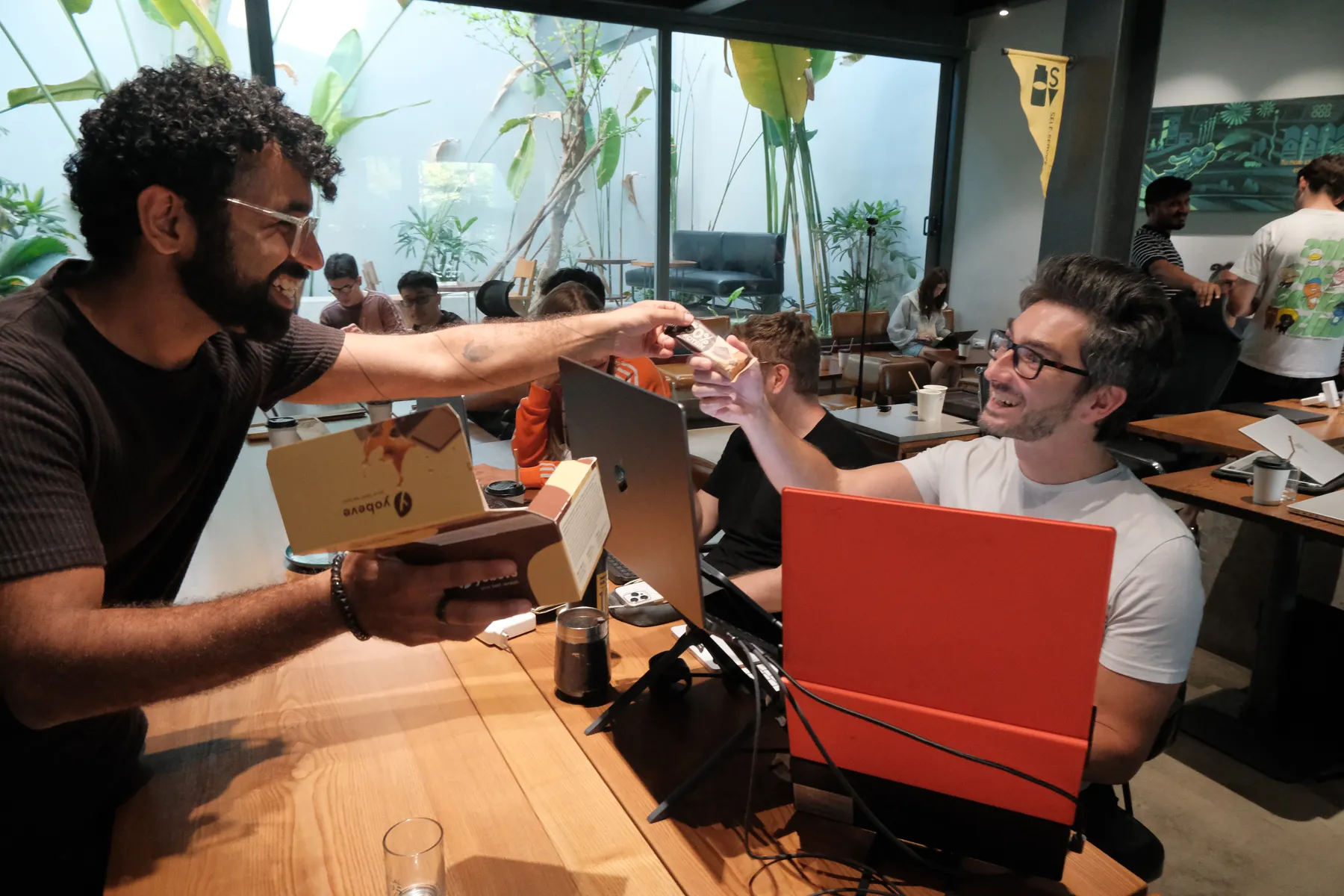 Builders sharing a high five across the table